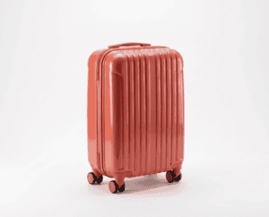 ABS hard-shell carry-on suitcase in coral red