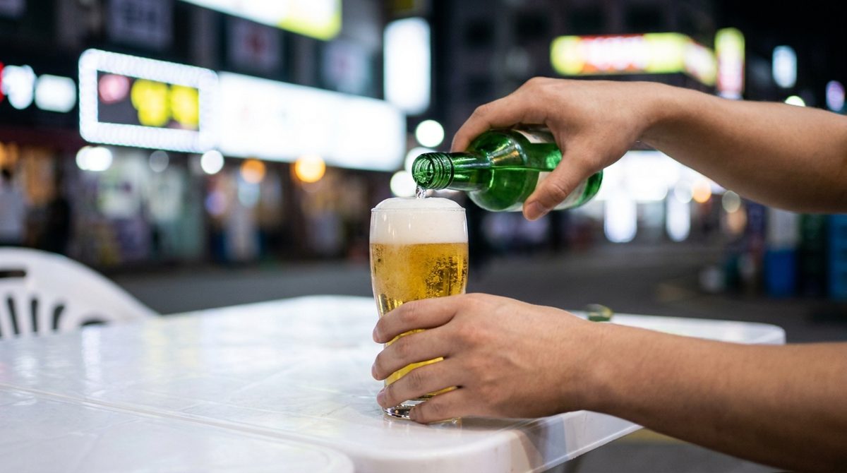 Making somaek - mixing soju and beer from convenience store alcohol in korea